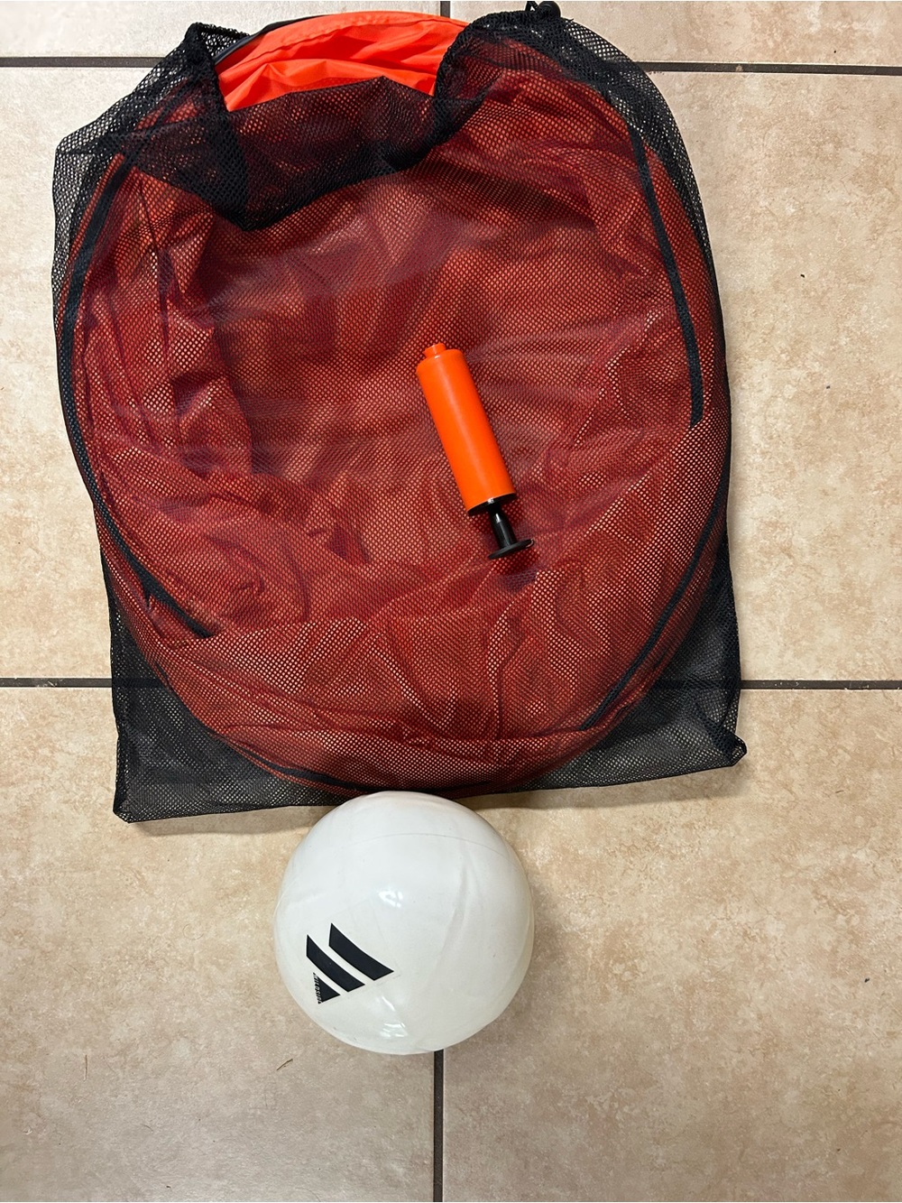 White Volleyball with Orange Pump and Black Mesh Bag